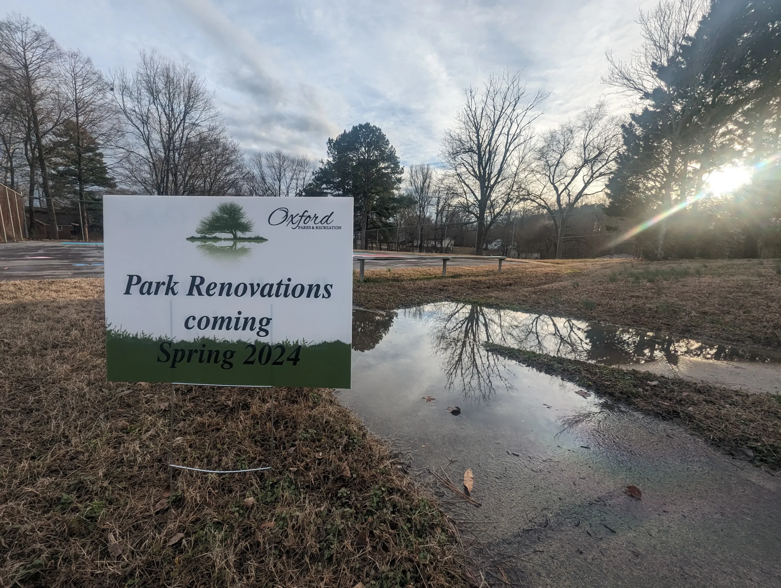 A sign says Park Renovations coming Spring 2024 at the Granville Street Park in Oxford, NC.